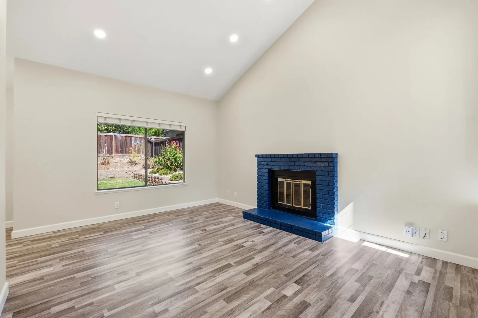 Updated living room with vaulted ceilings and fireplace at 2300 Lake Park Ct